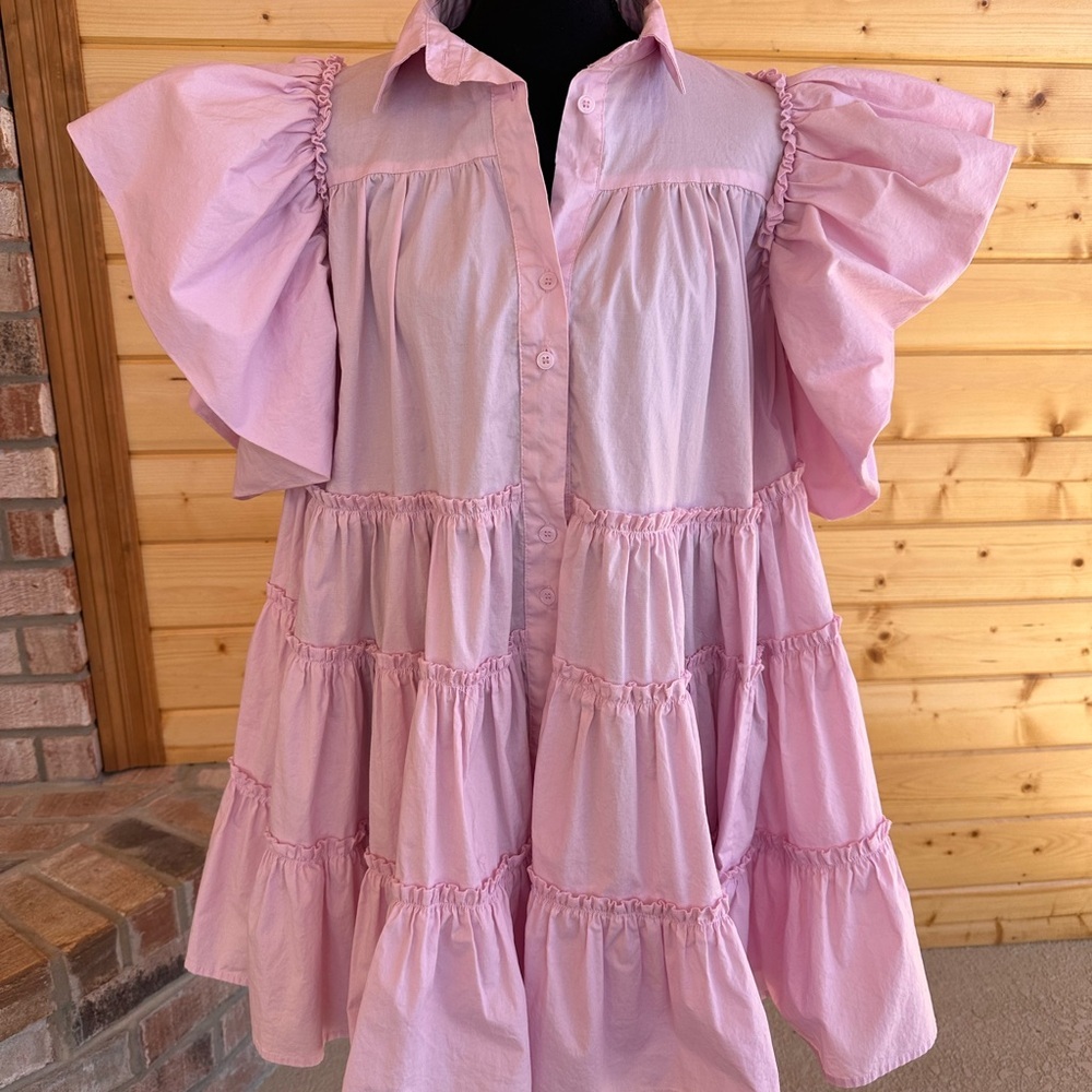 Klesis. Pink Tiered Dress with fun butterfly ruffle sleeves.